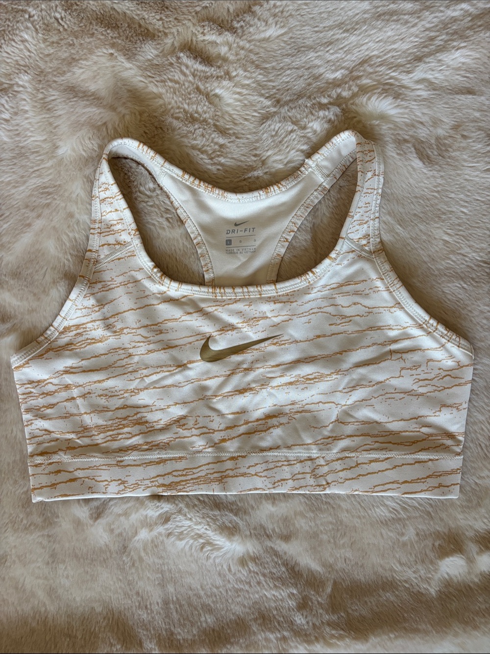 Nike White Sports Bra with Metallic Gold Swoosh and Pattern